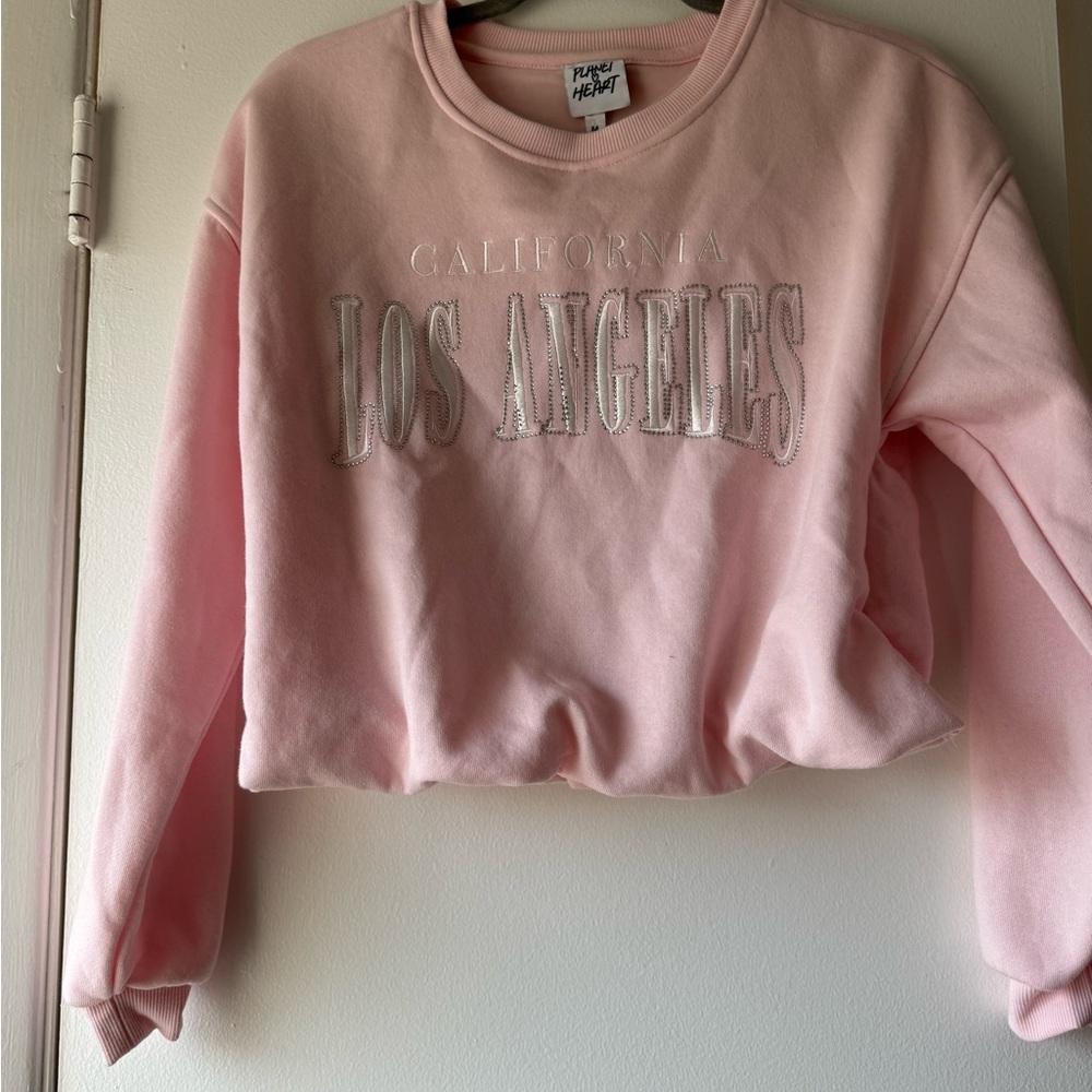 NWT pink cropped sweatshirt.